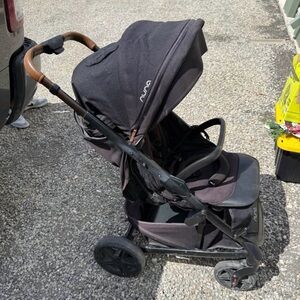 Nuna Black Stroller with Brown Accents